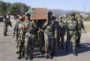 Indian Army soldiers carry a coffin containing the body of a colleague at a garrison in Rajouri